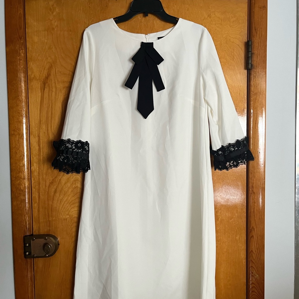 Elegant White Dress with Black Lace Accents